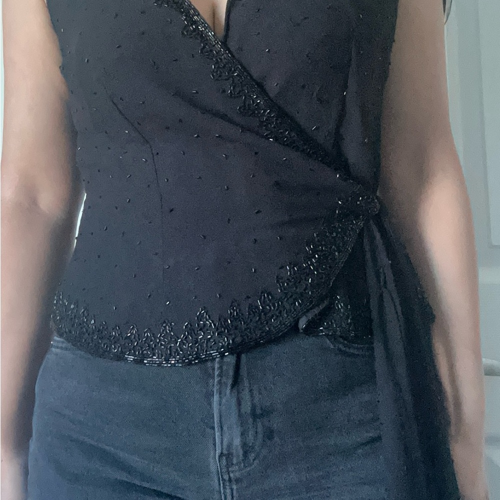 Elegant Black Wrap Sleeveless Blouse with Embellishments